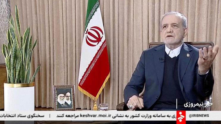 Iran's President Masoud Pezeshkian speaks during an interview with the state TV, amid protests, in Tehran