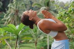 Young,Woman,Portrait,With,Praying,Hands,In,Front,Of,Her