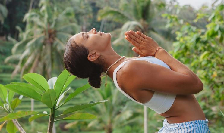 Young,Woman,Portrait,With,Praying,Hands,In,Front,Of,Her