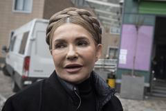 Julia Tymošenková se na mezinárodní scéně proslavila svým typickým účesem, ale i jako jedna z vůdčích osobností Oranžové revoluce v roce 2004