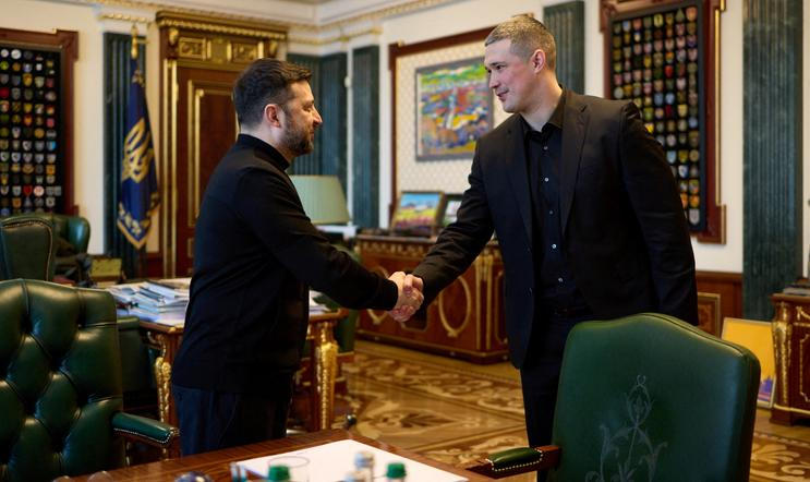 Ukraine's President Zelenskiy and newly appointed Defence Minister Fedorov shake hands before their meeting in Kyiv