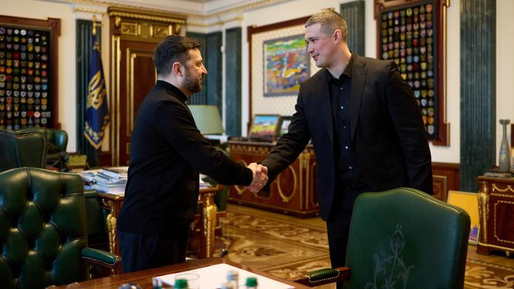 Ukraine's President Zelenskiy and newly appointed Defence Minister Fedorov shake hands before their meeting in Kyiv