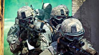 U.S. Army paratroopers assigned to the 1st Battalion, 508th Parachute Infantry Regiment, 82nd Airborne Division prepare to enter a building as they conduct close-quarters combat training during an air assault mission September 26, 2013 at Fort Bragg, NC.