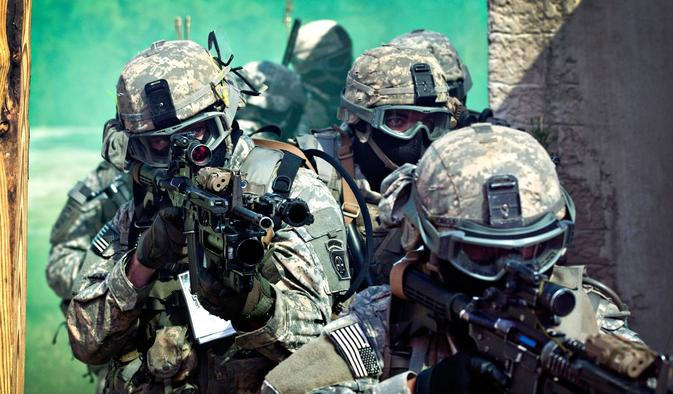 U.S. Army paratroopers assigned to the 1st Battalion, 508th Parachute Infantry Regiment, 82nd Airborne Division prepare to enter a building as they conduct close-quarters combat training during an air assault mission September 26, 2013 at Fort Bragg, NC.