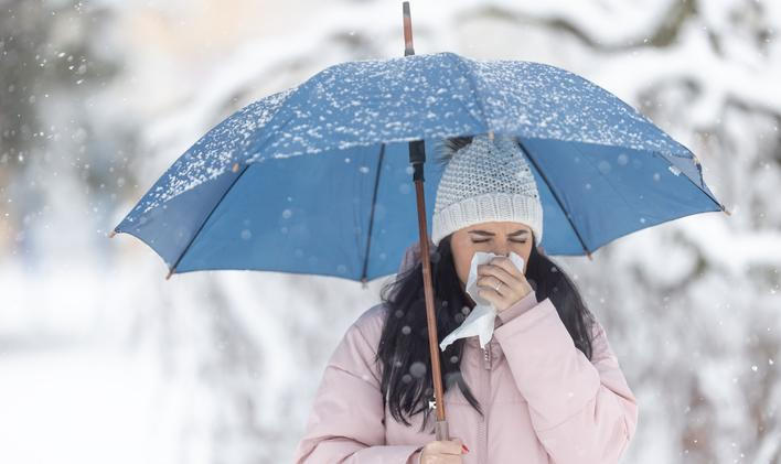 Woman,Holds,Umbrella,While,Clearing,Her,Nose,Due,To,Winter