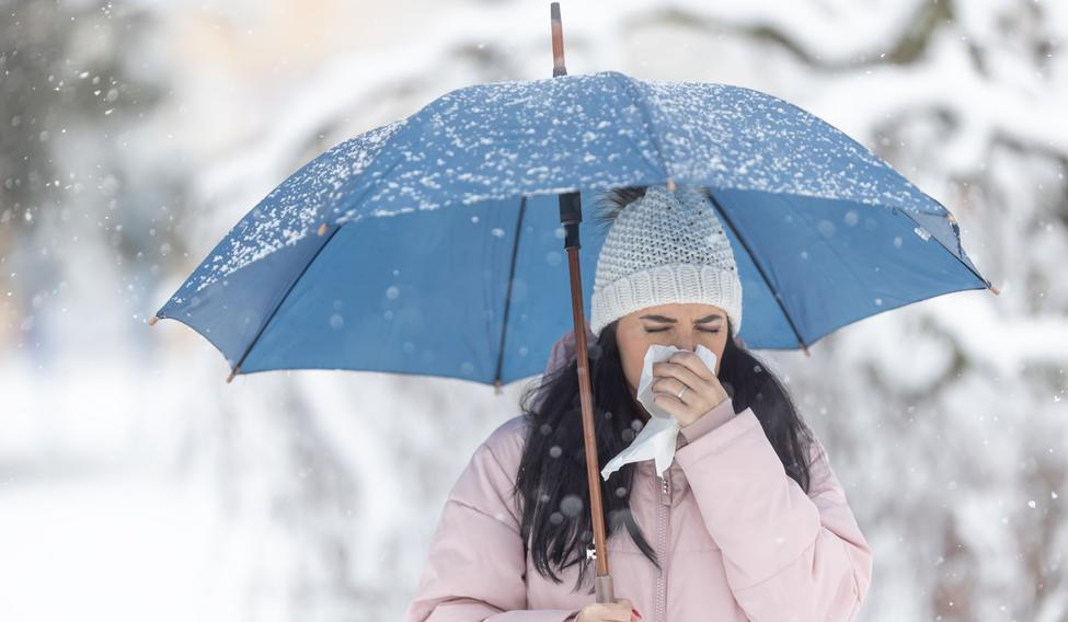 Woman,Holds,Umbrella,While,Clearing,Her,Nose,Due,To,Winter