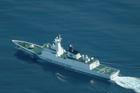 FILE PHOTO: An aerial view of a China Coast Guard ship navigating near the disputed Scarborough Shoal, as Philippine Coast Guard aircraft carrying journalists patrols the area