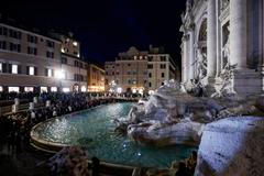 Tourists visit the Trevi Fountain in Rome