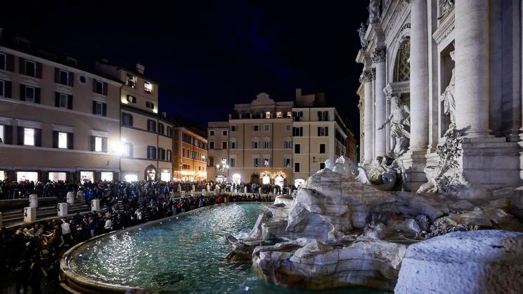 Tourists visit the Trevi Fountain in Rome