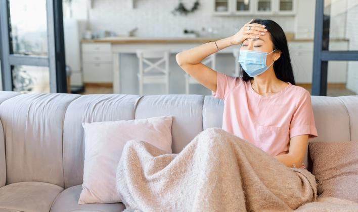 An,Ill,Asian,Woman,Wearing,Face,Mask,Sits,Alone,At