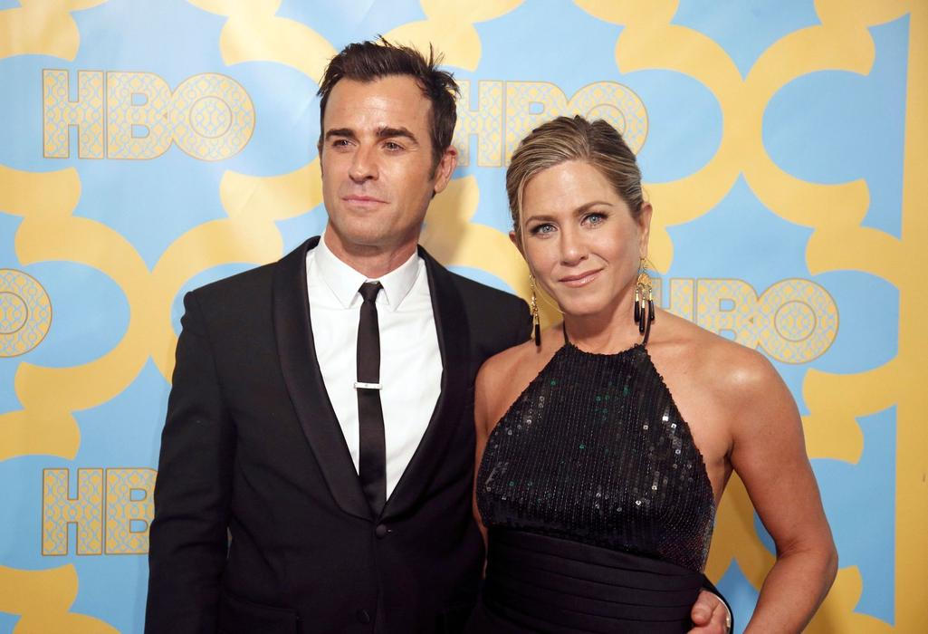 Actors Jennifer Aniston and Justin Theroux pose at the HBO after-party after the 72nd annual Golden Globe Awards in Beverly H