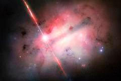 NASA zveřejnila koncept výbuchu GRB 250702B (vlevo od středu) uvnitř jeho hostitelské galaxie.