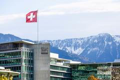 FILE PHOTO: A Swiss flag flutters on the headquarters of Nestle in Vevey