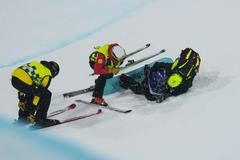 Ošetřovaná korejská snowboardistka Čche Ka-on ve finále  U-rampy na ZOH 2026