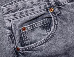 Small,Coin,Pocket,With,Metal,Rivets,On,Gray,Jeans,,Close