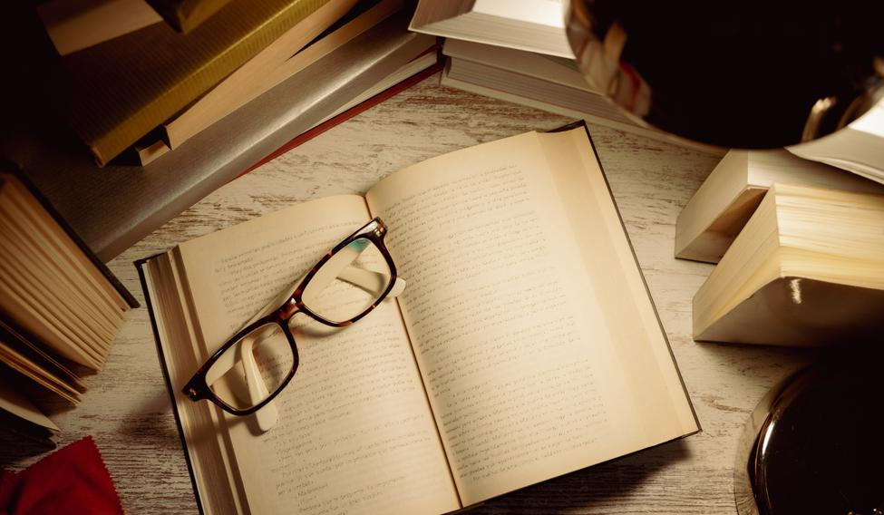 Top,View,Open,Book,With,Glasses,On,Top,Surrounded,By