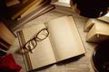 Top,View,Open,Book,With,Glasses,On,Top,Surrounded,By