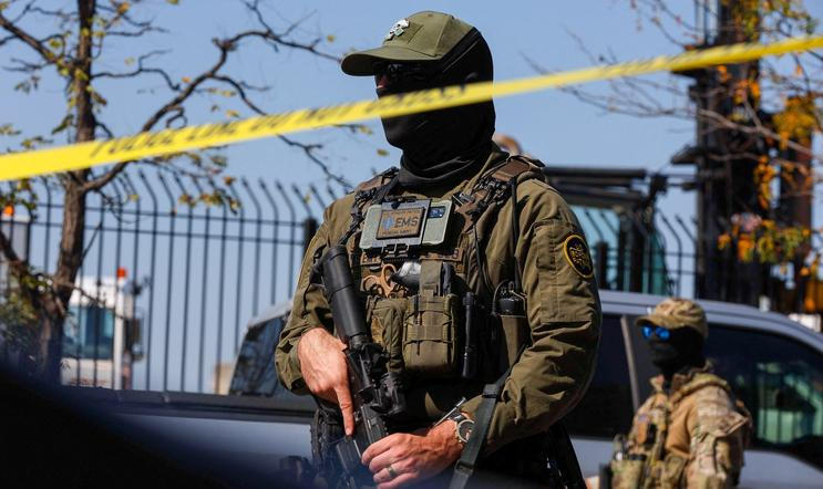 FILE PHOTO: People protest during a standoff with ICE and federal officers in Chicago