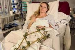 U.S. skier Lindsey Vonn lies in a hospital bed, after she crashed during the Women's Downhill, in Treviso