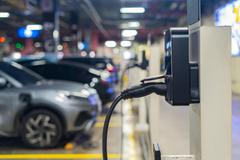 Electric,Cars,Are,Being,Charged,At,Electric,Vehicle,Charging,Stations.