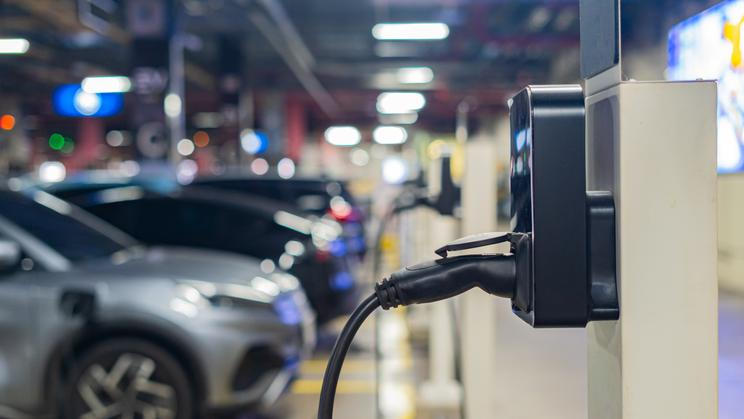 Electric,Cars,Are,Being,Charged,At,Electric,Vehicle,Charging,Stations.