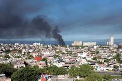 Smoke billows, following a military operation in which a government source said Mexican drug lord Nemesio Oseguera, known as "El Mencho," was killed, in Puerto Vallarta