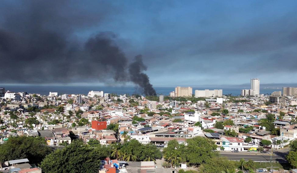 Smoke billows, following a military operation in which a government source said Mexican drug lord Nemesio Oseguera, known as "El Mencho," was killed, in Puerto Vallarta