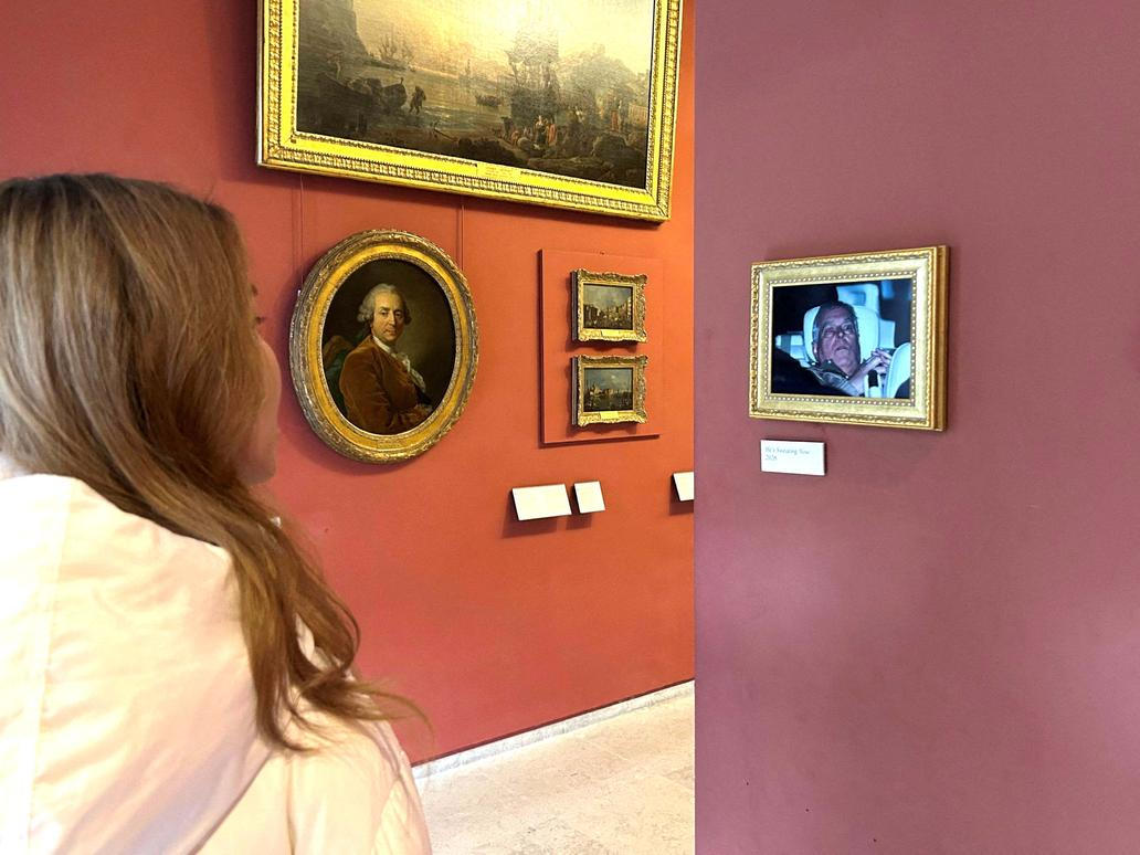 A picture of Andrew Mountbatten Windsor put up by activists in the Louvre, in Paris