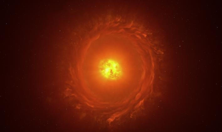 Umělecká rekonstrukce hvězdy WOH G64, prvního objektu mimo naši Galaxii, který se podařilo zobrazit v detailním přiblížení. Nachází se ve vzdálenosti více než 160 000 světelných let ve Velkém Magellanově mračnu. Ilustrace zachycuje její hlavní rysy: vejčitý prachový kokon obklopující hvězdu a prachový prstenec (torus). Existence i přesný tvar prstence však zatím vyžadují další pozorování.