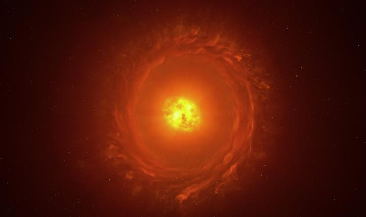 Umělecká rekonstrukce hvězdy WOH G64, prvního objektu mimo naši Galaxii, který se podařilo zobrazit v detailním přiblížení. Nachází se ve vzdálenosti více než 160 000 světelných let ve Velkém Magellanově mračnu. Ilustrace zachycuje její hlavní rysy: vejčitý prachový kokon obklopující hvězdu a prachový prstenec (torus). Existence i přesný tvar prstence však zatím vyžadují další pozorování.