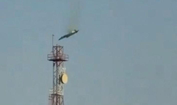 A burning aircraft falls from the sky in Al Jahra, in this still image obtained from social media video