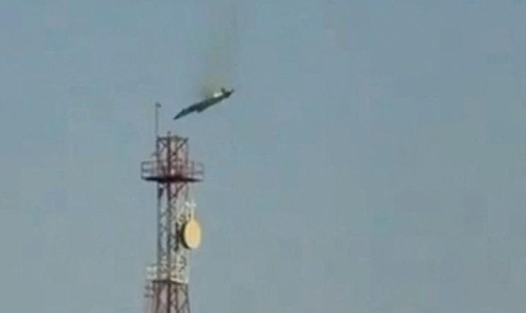 A burning aircraft falls from the sky in Al Jahra, in this still image obtained from social media video