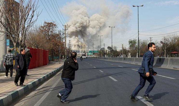 Smoke rises following an explosion, amid the U.S.-Israeli conflict with Iran, in Tehran
