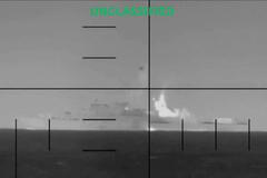 An explosion on what the U.S. Department of Defense says is an Iranian warship, at the sea