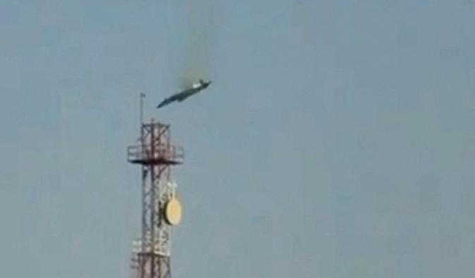 A burning aircraft falls from the sky in Al Jahra, in this still image obtained from social media video