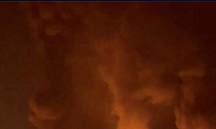 Fire burns and smoke rises from Aqdasieh Oil Depot in Tehran