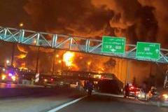 Fire burns and smoke rises from Aqdasieh Oil Depot in Tehran