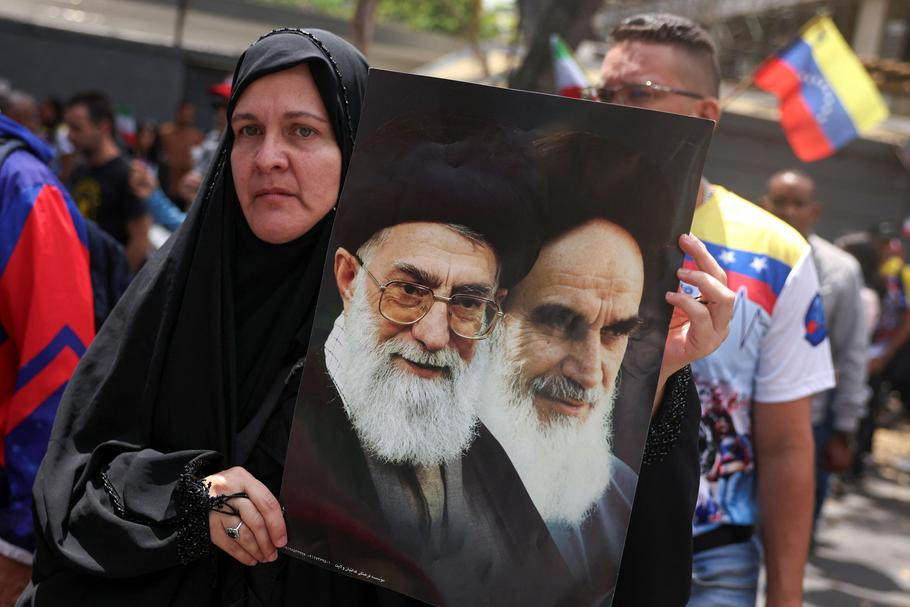 People participate in a rally in support of Iran, in Caracas