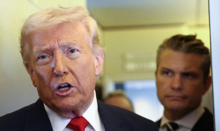 Trump speaks to reporters aboard Air Force One