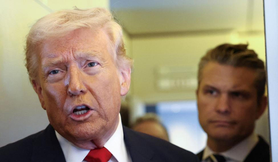 Trump speaks to reporters aboard Air Force One