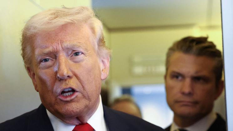 Trump speaks to reporters aboard Air Force One