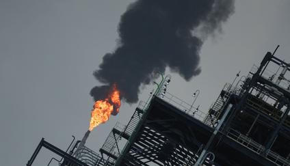 A flame rises from a gas flare at the Dangote refinery refinery in Lagos, Nigeria