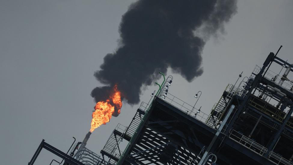 A flame rises from a gas flare at the Dangote refinery refinery in Lagos, Nigeria