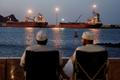 Galaxy Globe bulk carrier and Luojiashan tanker sit anchored in Muscat
