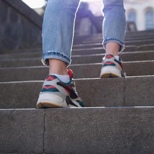 Female,Legs,In,Sports,Sneakers,Going,Up,Stairs,Closeup.,Hiking