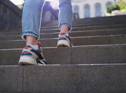 Female,Legs,In,Sports,Sneakers,Going,Up,Stairs,Closeup.,Hiking