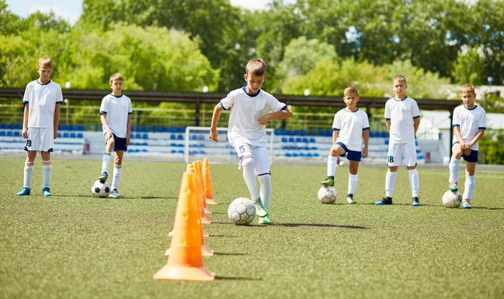 Team of Boys Training for Football Game