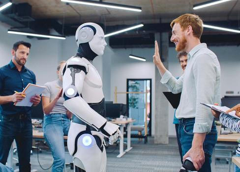 Multi-ethnic,Group,Of,People,Gathering,Together,To,Watch,Humanoid,Robot