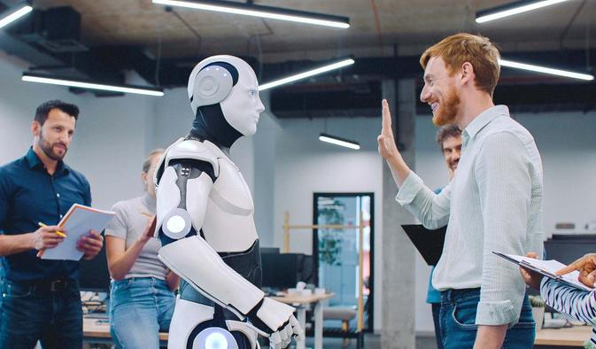 Multi-ethnic,Group,Of,People,Gathering,Together,To,Watch,Humanoid,Robot