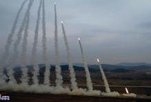 North Korean leader Kim oversees test-launch of multiple rocket launchers